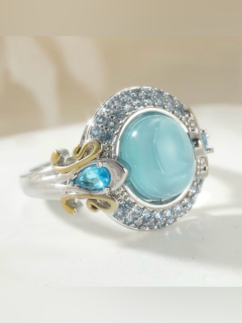 Sterling Silver Aquamarine Cabochon Halo Ring with Blue Accent Stones